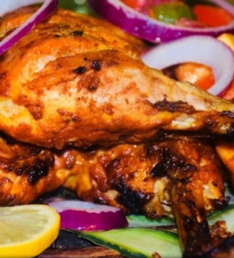 Akmal's Tandoori Bistro — whole tandoori chicken dish