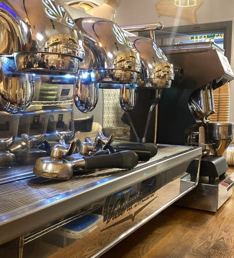 Cafe Espresso — commercial espresso machine behind the counter