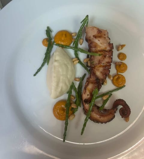 Octopus with samphire, cauliflower purée and romesco at Sous Le Nez