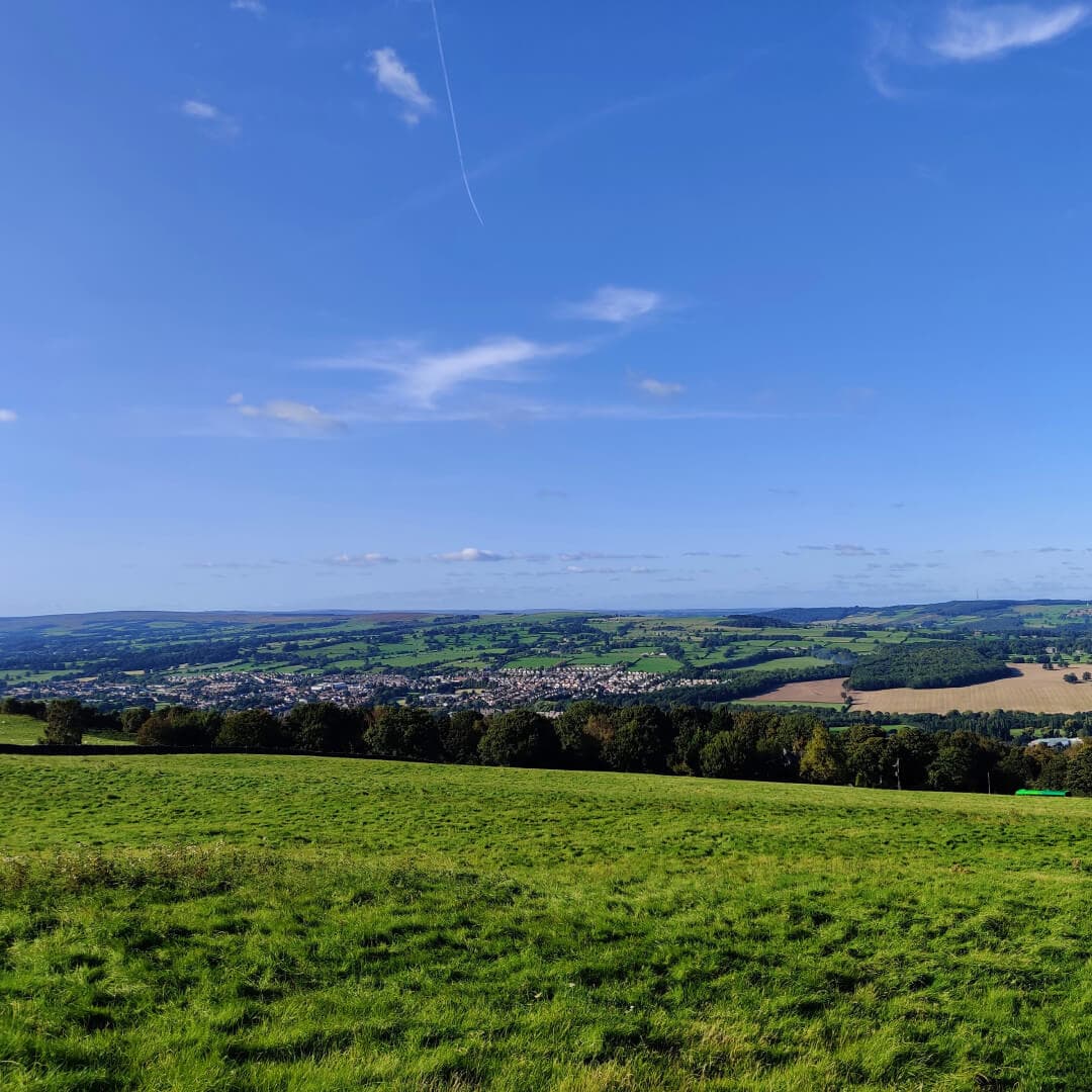View over Otley Chevin Forest Park from a grassy field
