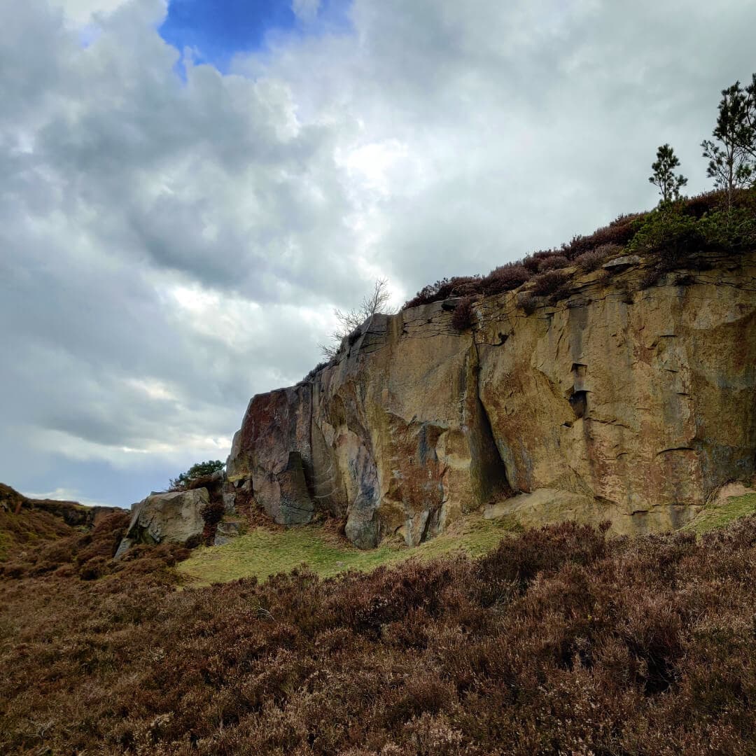 Ilkley Moor cliff and dark sky