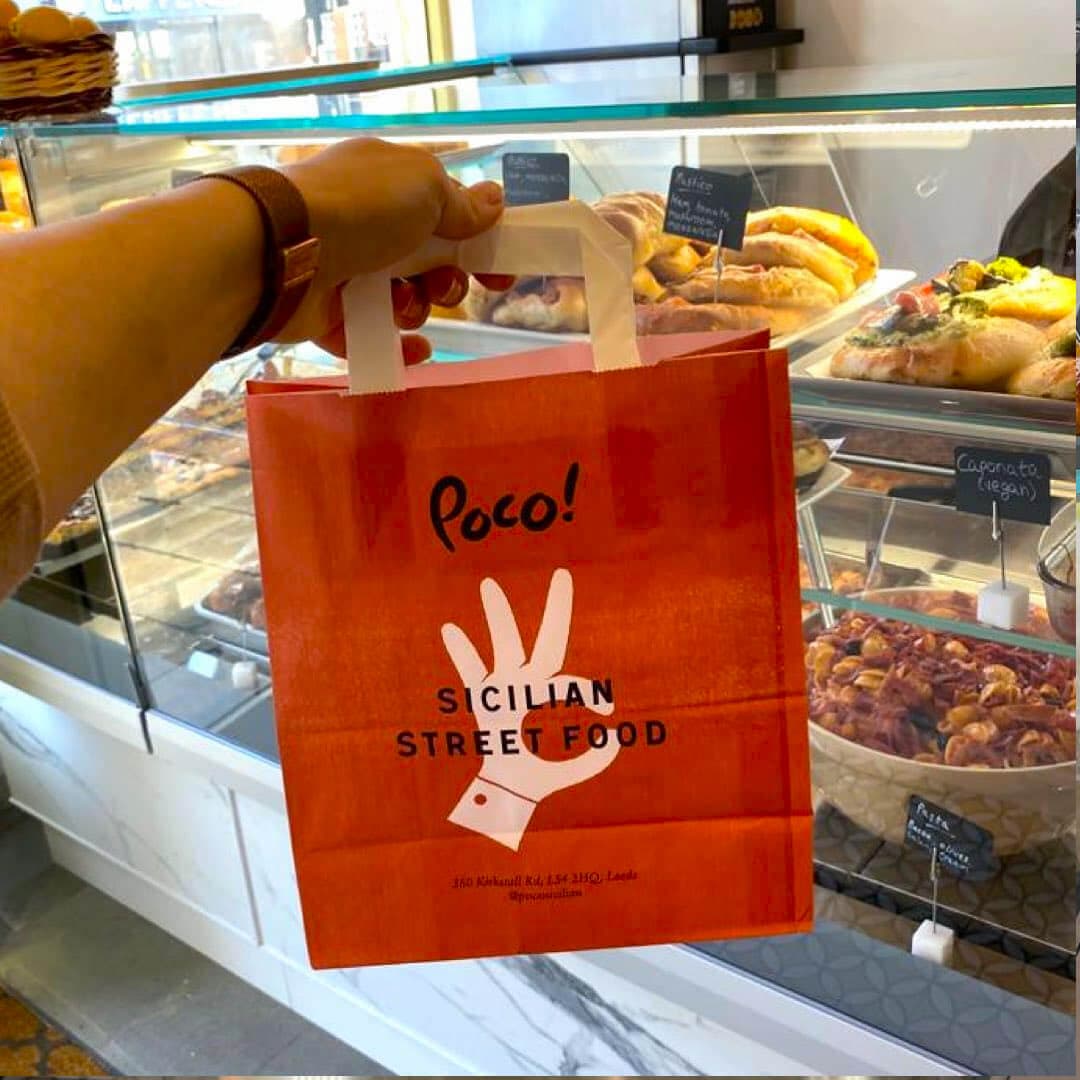 Poco Headingley inside shop with bag