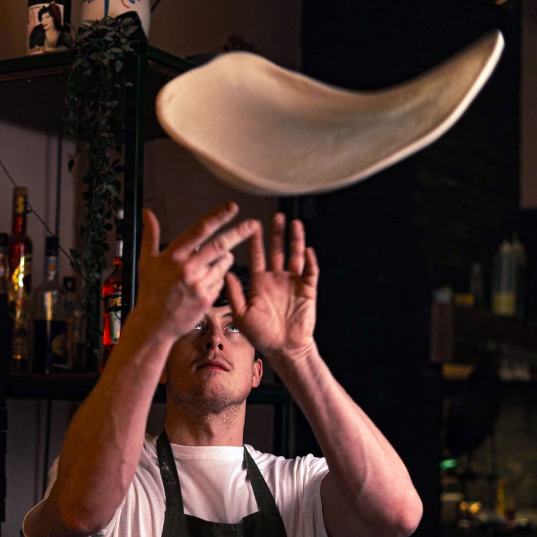 Spinning dough at Pizza Loco