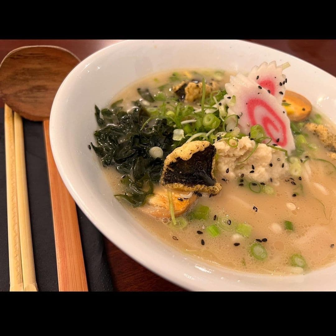 Bowl of traditional ramen with seaweed, egg, and vegetables at Fuji Hiro.