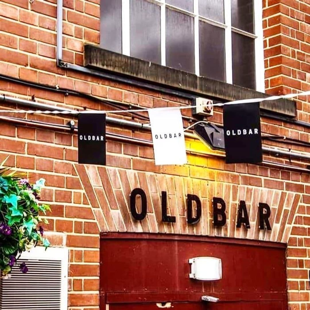 Exterior view of Old Bar at Leeds Uni with brick walls and signage displaying the name 'OLDBAR' in capital letters.