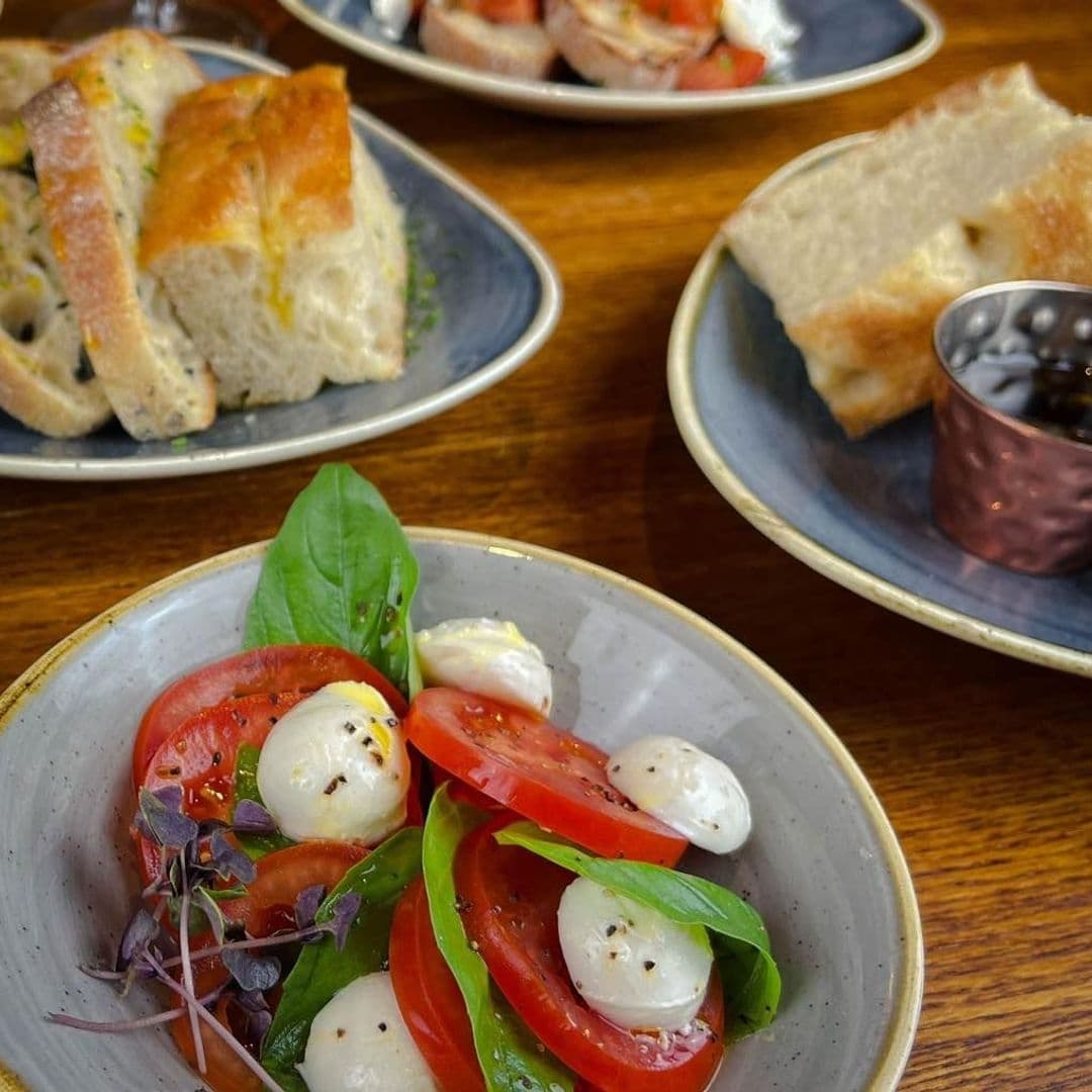 Fresh Caprese salad with ripe tomatoes, mozzarella, and basil at Scotts Arms.