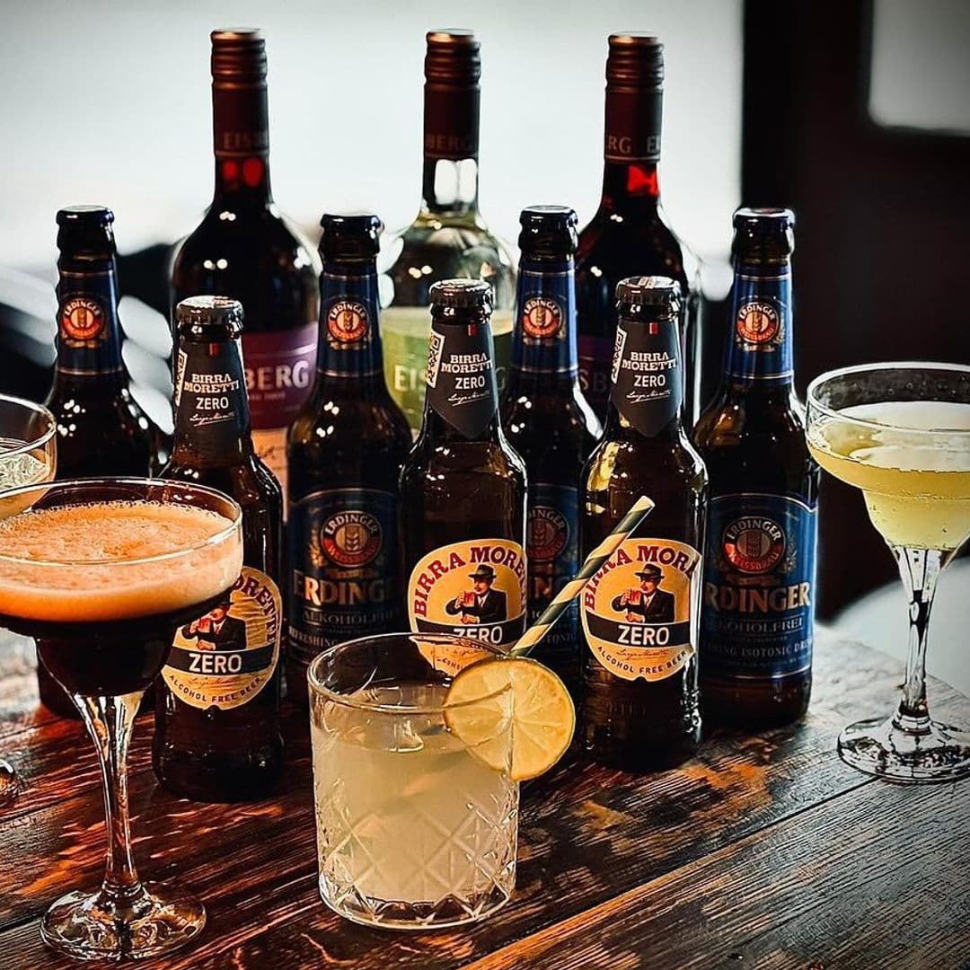 Assorted alcoholic beverages and mocktails on a bar counter at Seven Hills.
