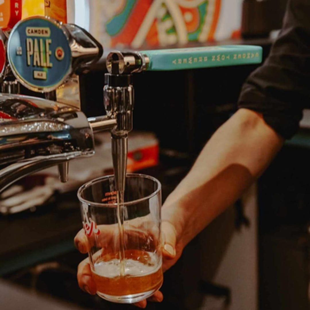 Camden Pale Ale being poured at the bar at Aarti Bar and Restaurant Leeds