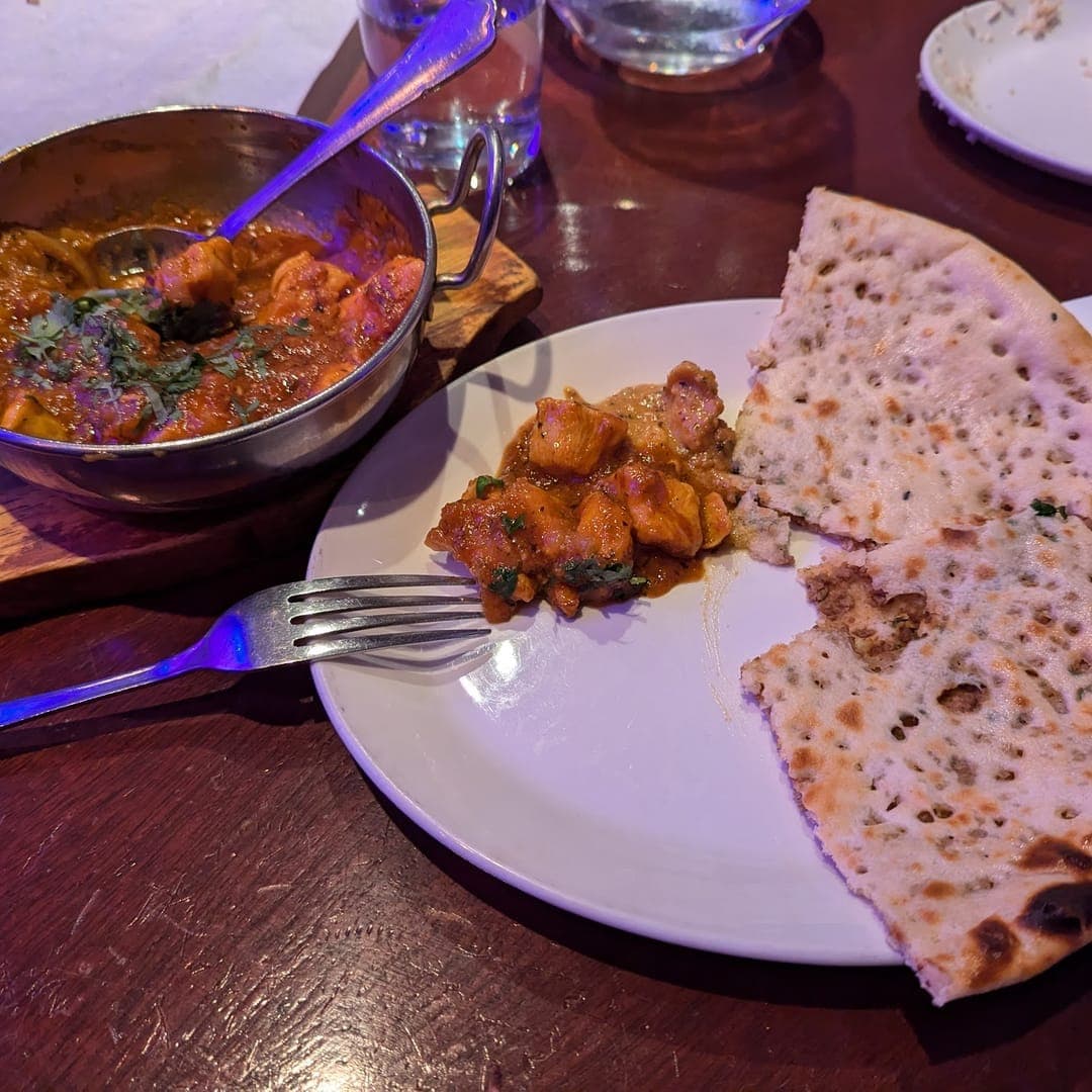 Akmal's Tandoori Bistro — chicken curry in karahi with naan bread