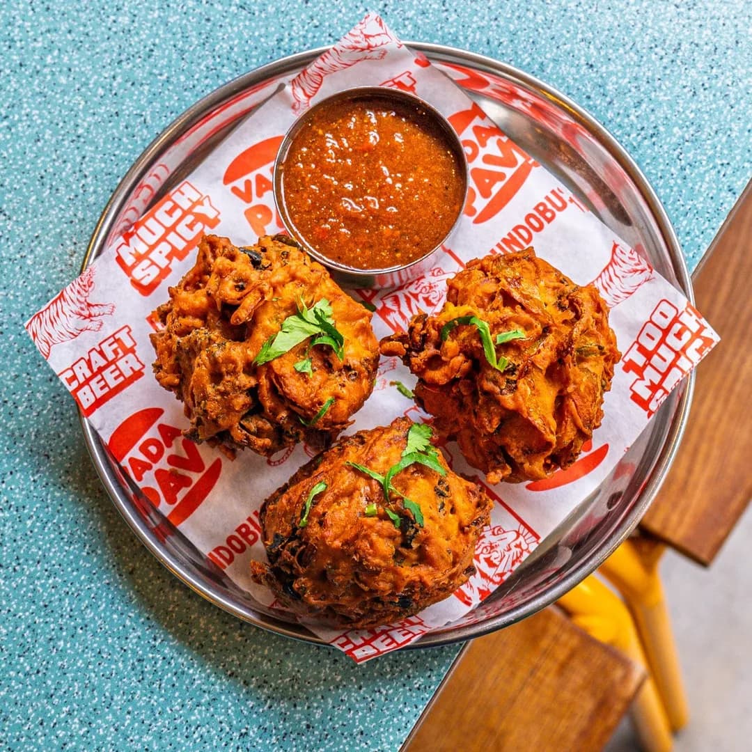 Bundobust bhajis with tamarind chutney on signature blue table