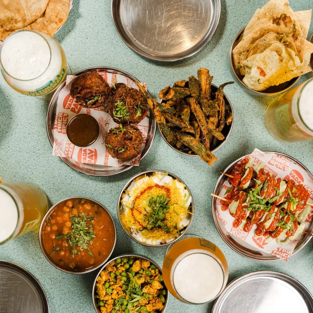 Bundobust food spread with craft beer, bhajis, okra fries and dhal