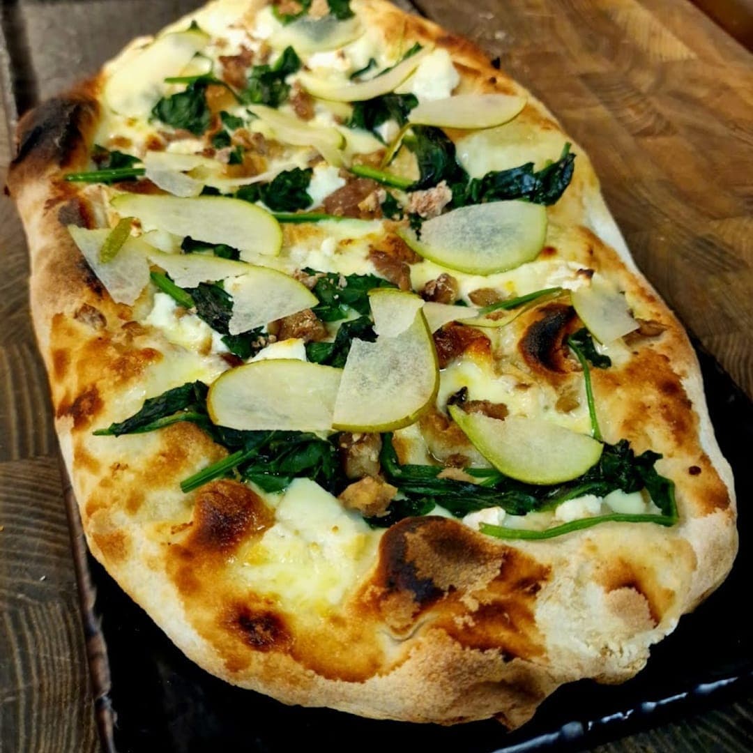 Buon Apps River Lounge — bianca pinsa with spinach, pear and ricotta