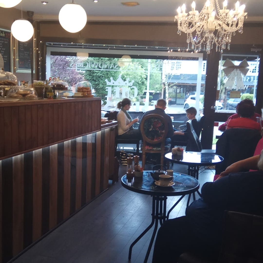 Cafe Espresso — cosy interior with striped booths and chandelier