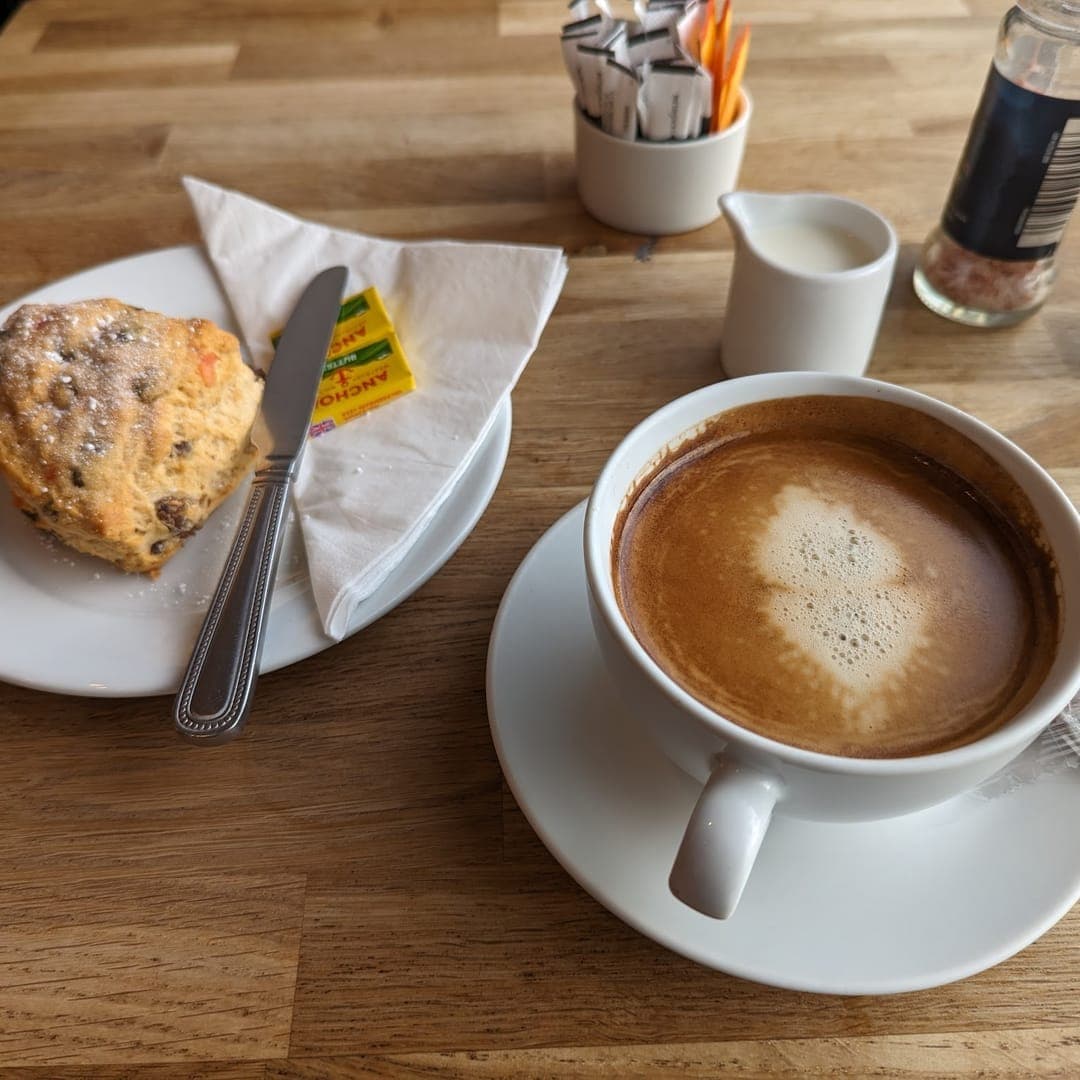 Cafe Espresso — scone with butter and coffee