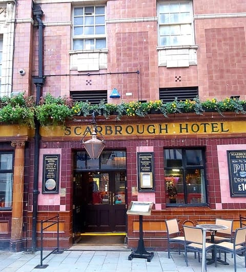 The Scarbrough Hotel — Grade II listed exterior with ornate pink and gold tiled facade on Bishopgate Street