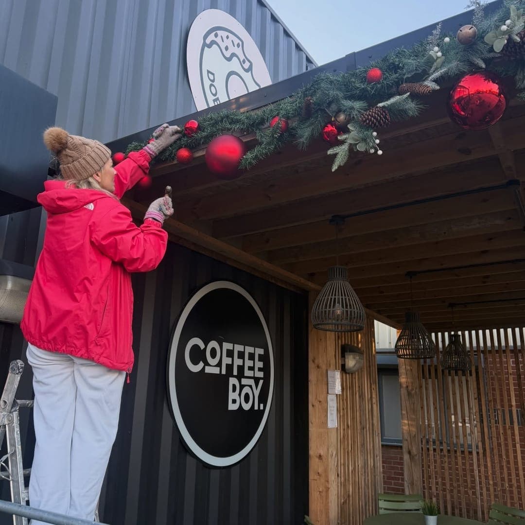 Coffeeboy Headingley exterior decorated with Christmas garlands and baubles