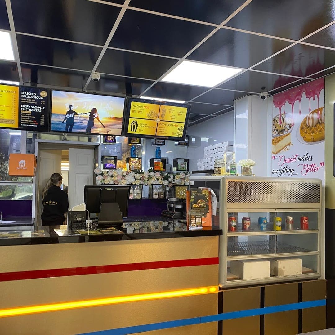 FiveStar burgers and shakes — restaurant counter with yellow and black branding