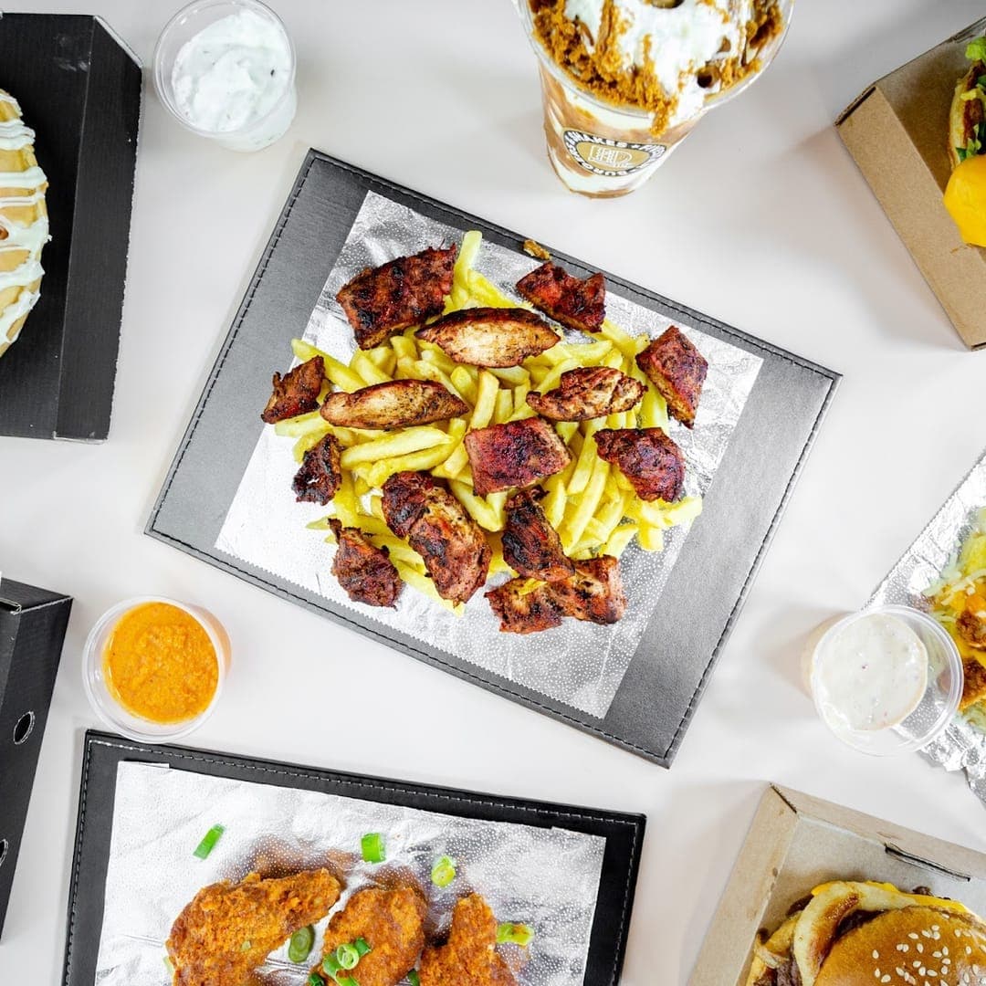 FiveStar burgers and shakes — spread of menu items including burgers, fries and waffle