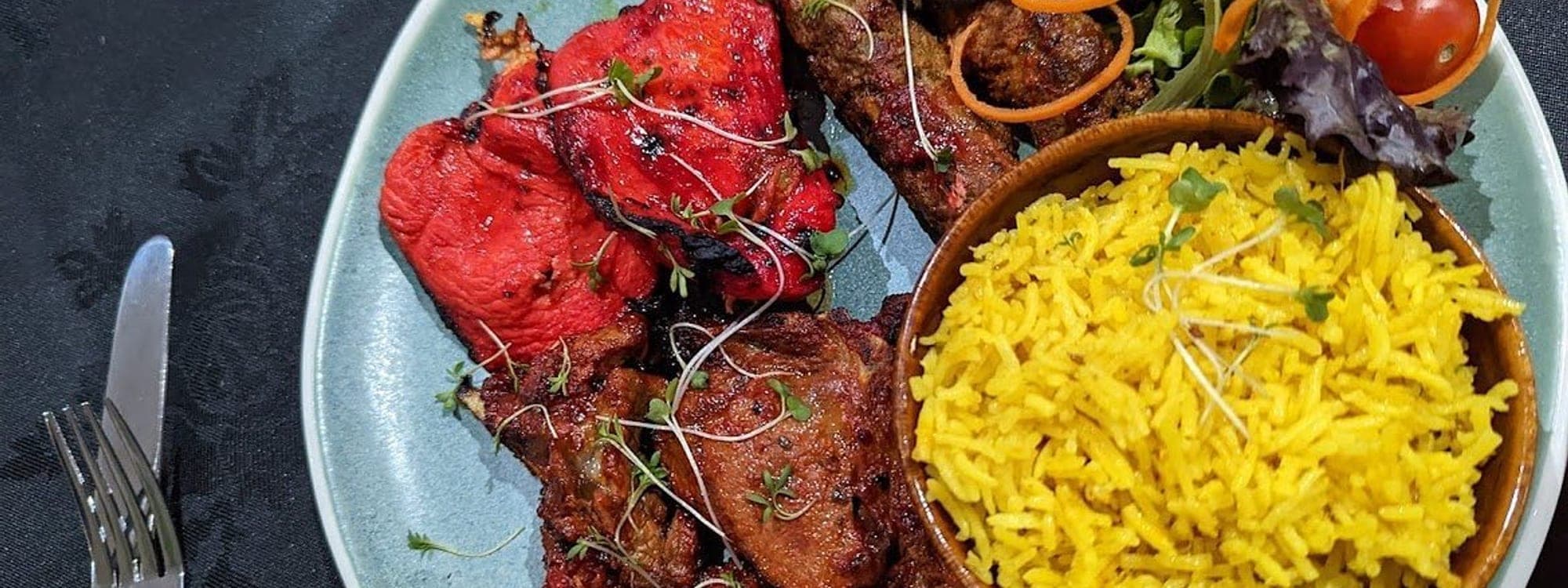 Fusion Spice — tandoori mixed platter with chicken tikka, seekh kebab, saffron rice and microgreens