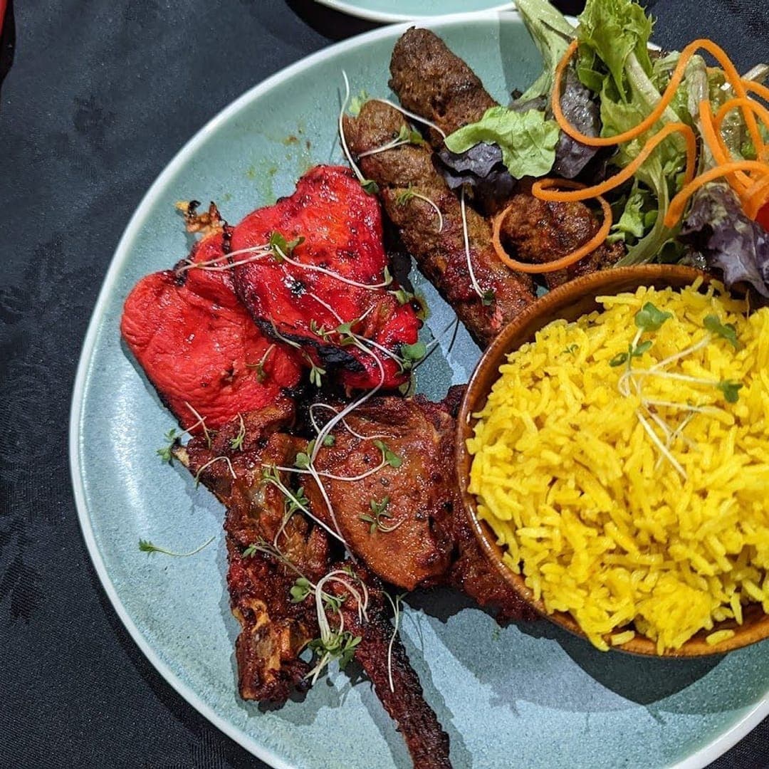 Fusion Spice — tandoori mixed platter with chicken tikka, seekh kebab, saffron rice and microgreens
