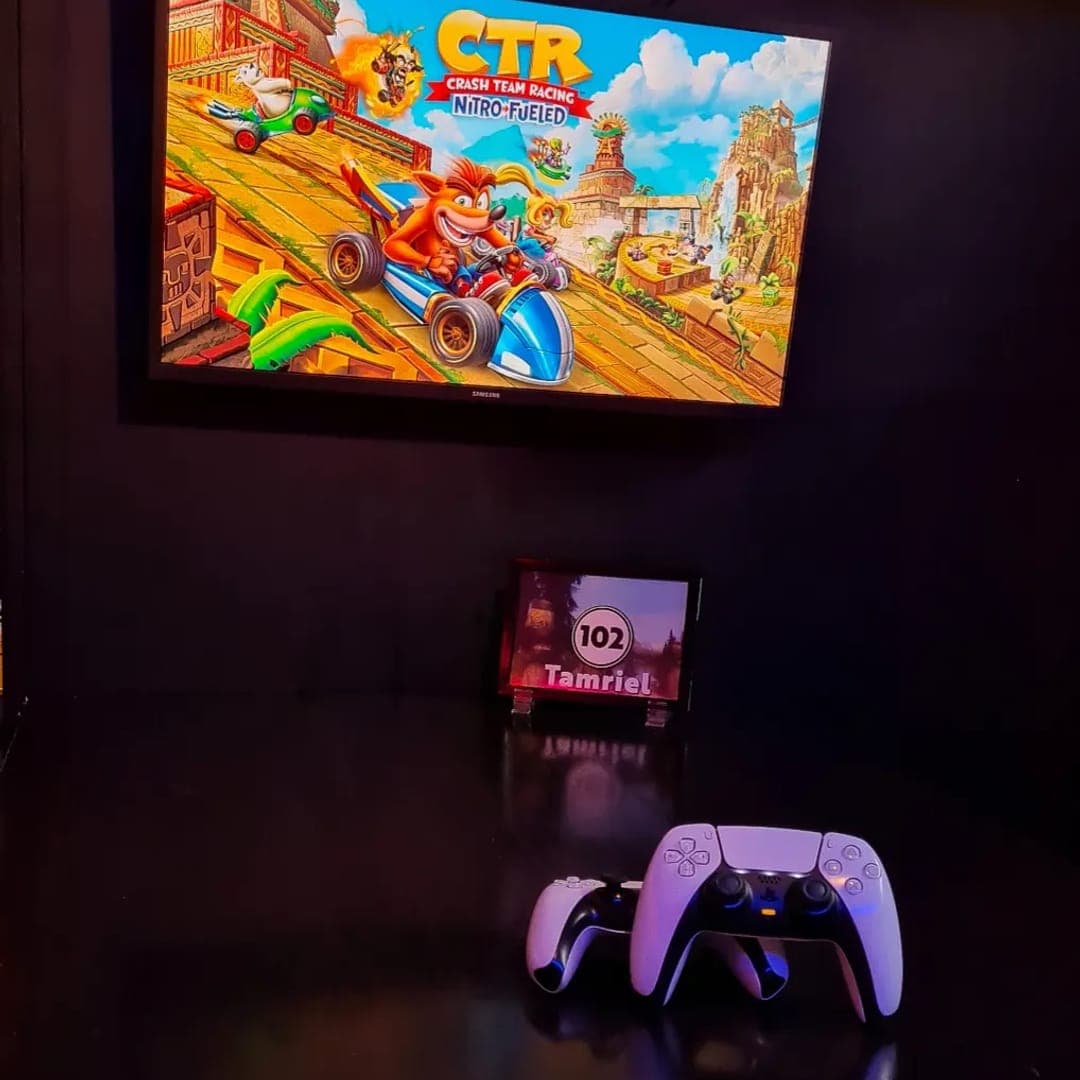 Crash Team Racing on screen with PS5 controller in Tamriel booth at Pixel Bar Leeds