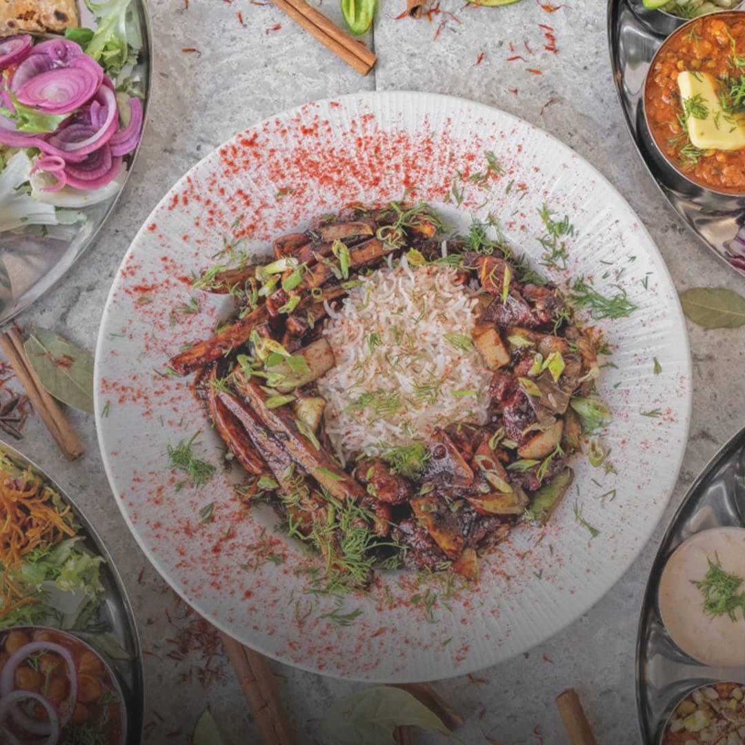 Delhi Wala Food biryani with thali plates and accompaniments