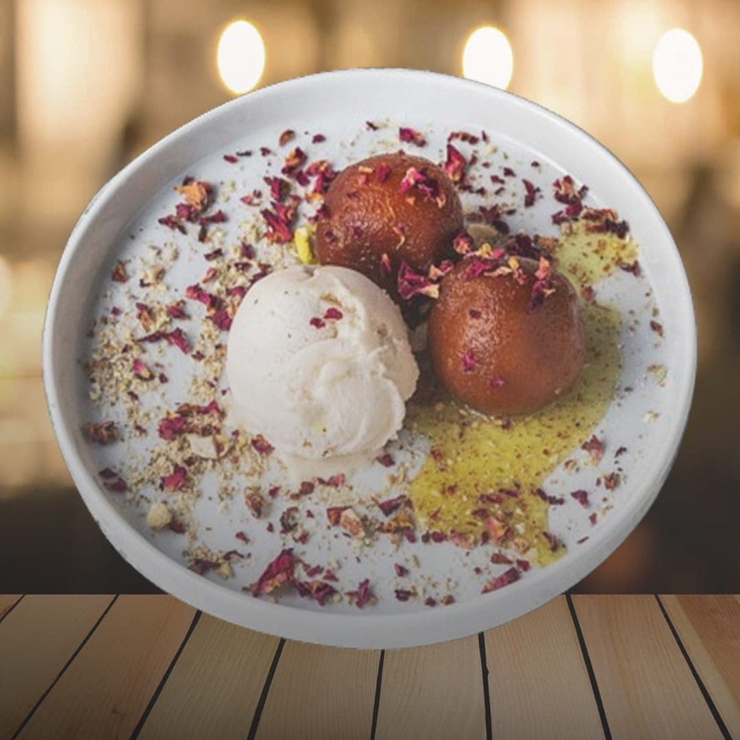 Delhi Wala Food gulab jamun dessert with ice cream and rose petals