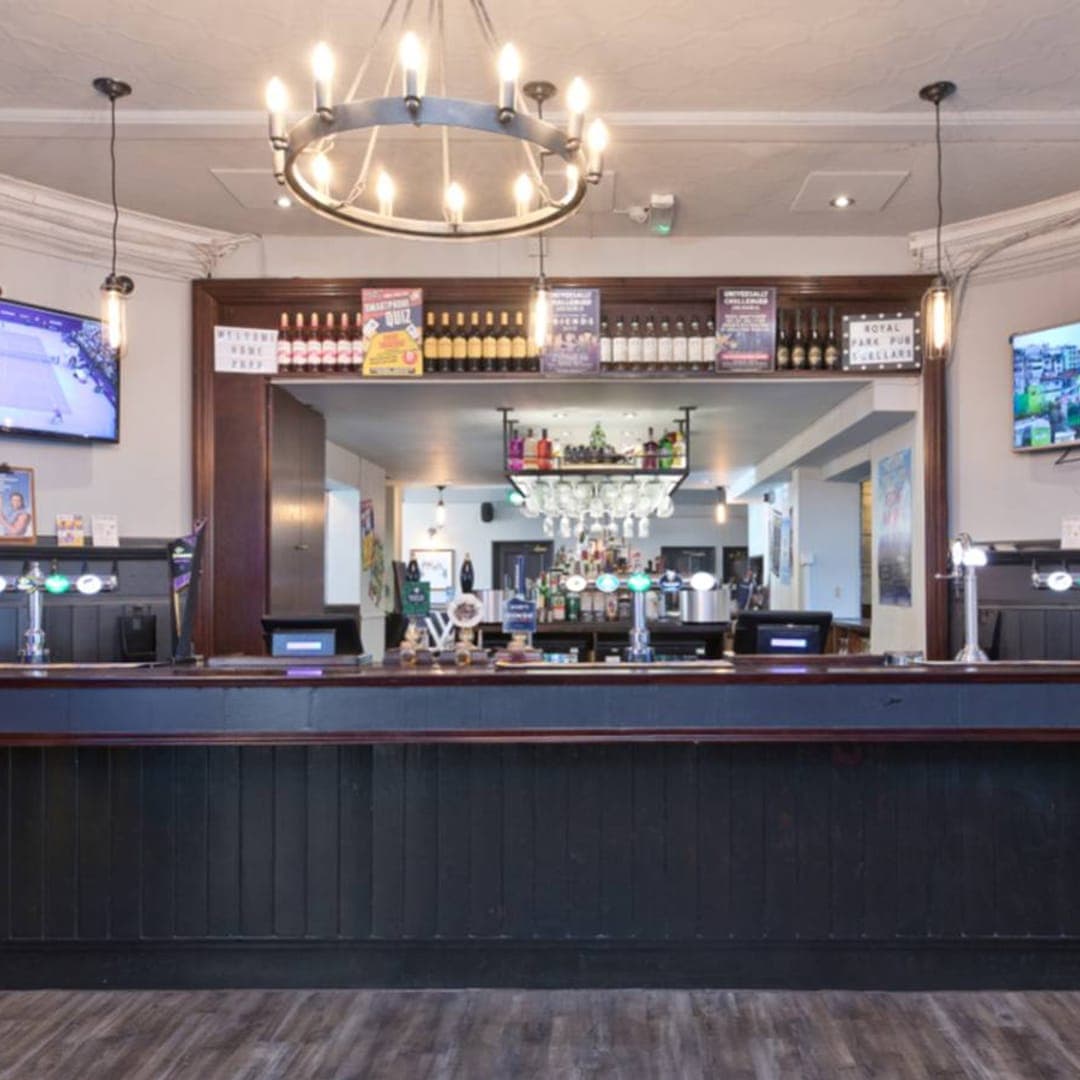 Main bar counter with beer taps at The Royal Park Leeds