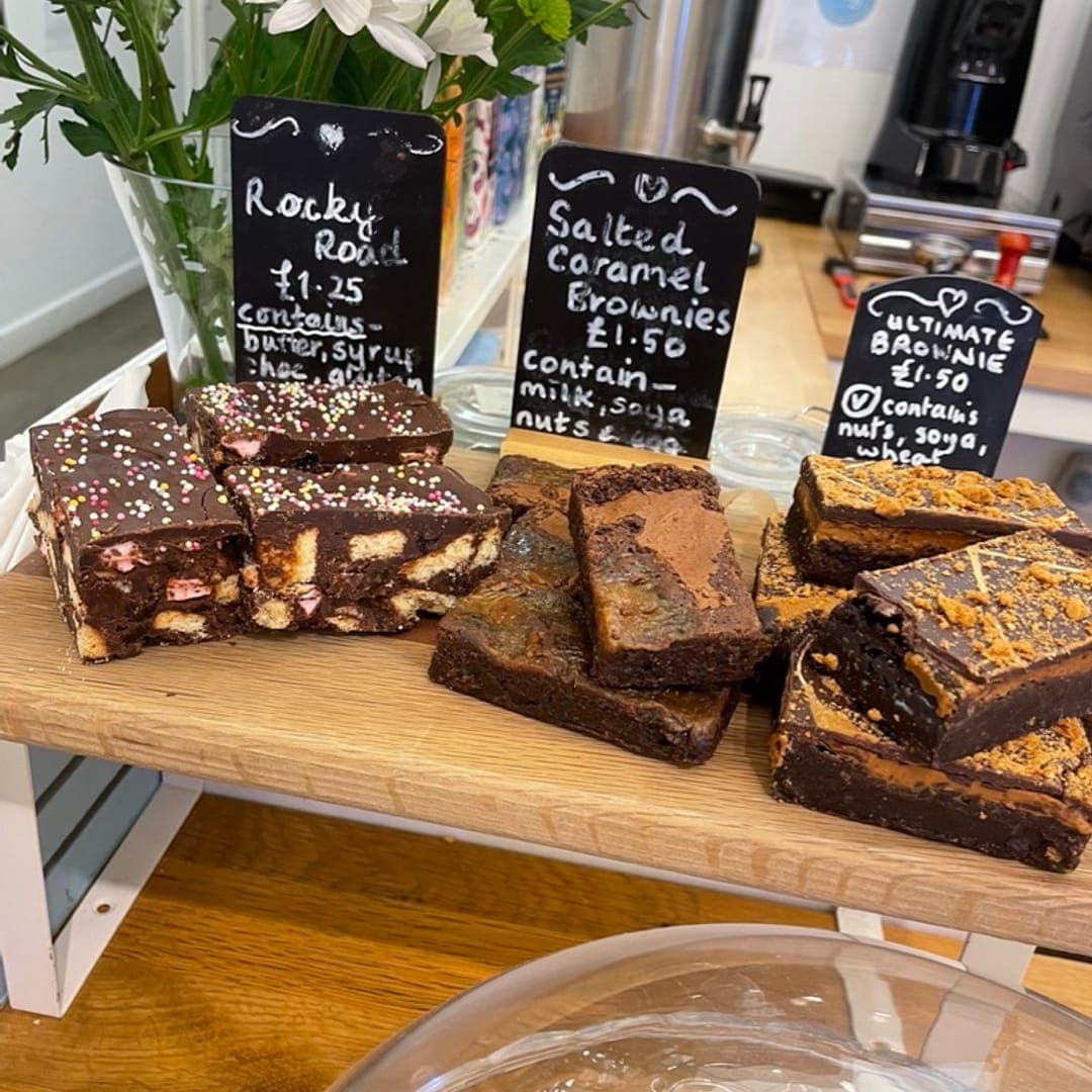 Brownie display at 21 Co. featuring rocky road, salted caramel, and chocolate brownies