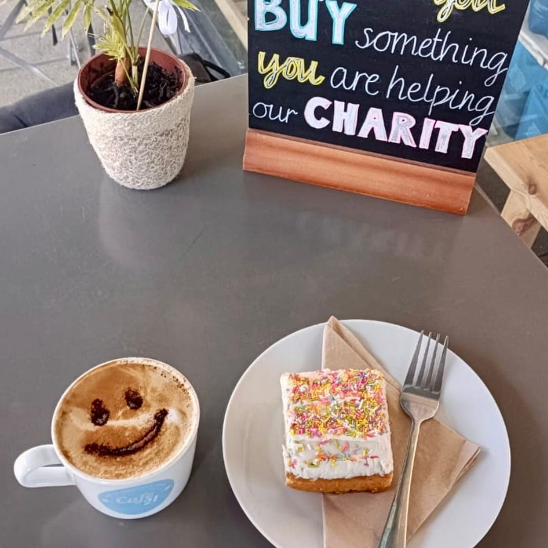 Smiley face latte art and sprinkle cake at 21 Co. Headingley