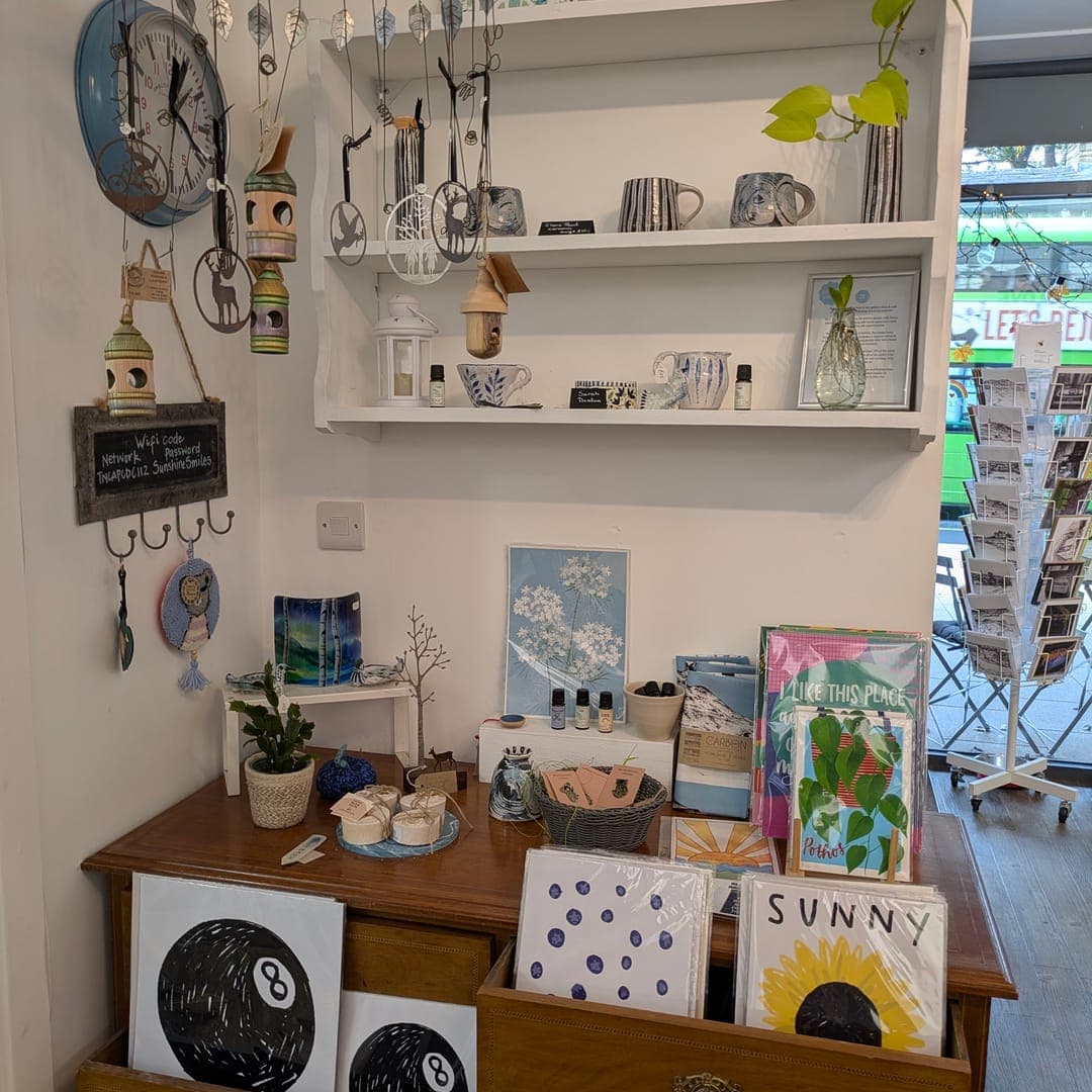 Gift shop display at 21 Co. featuring local crafts, cards, and ceramics