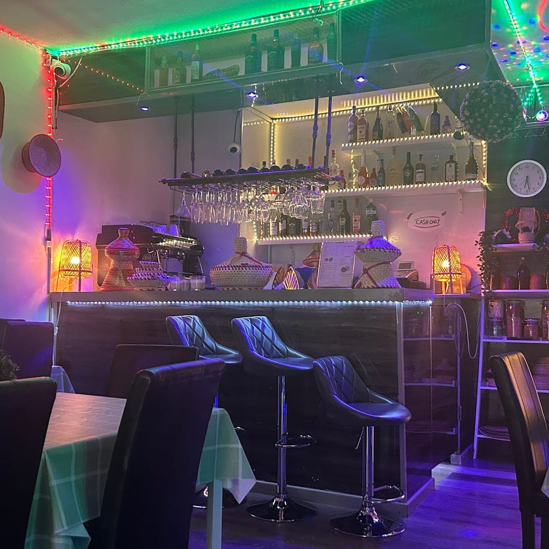 Bar area at Abashawel Restaurant with LED lighting and bar stools