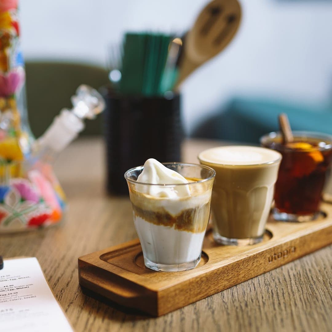Coffee tasting flight with affogato, latte, and iced coffee at Caffeine Addict