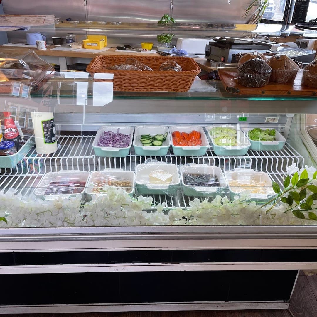Fresh deli counter at Chichini with salad toppings and sandwich fillings