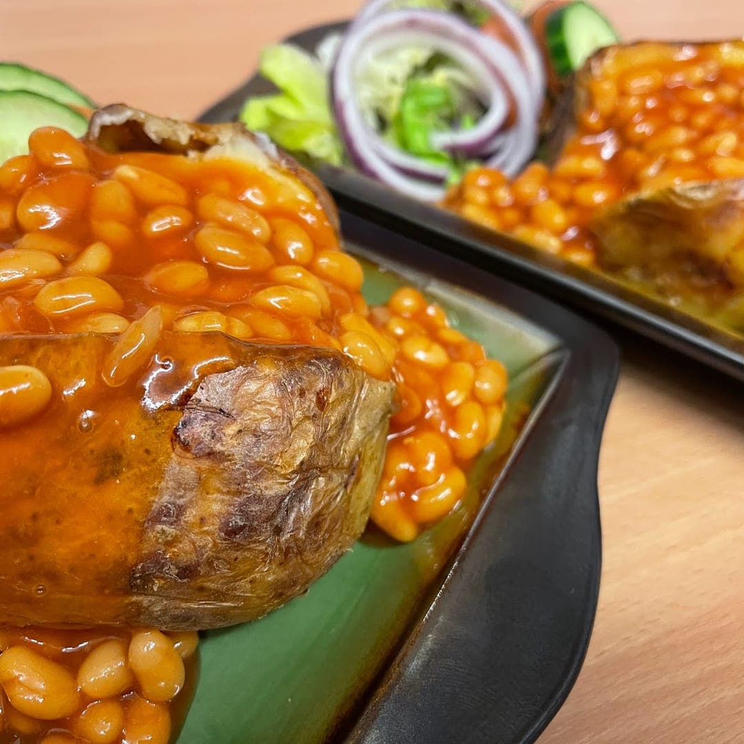 Jacket potatoes loaded with baked beans and side salad at Country Crust Leeds