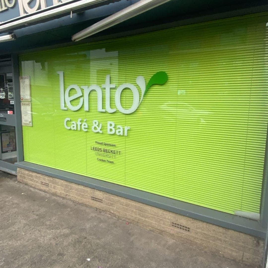 Green exterior of Lento Cafe and Bar with signage on North Lane Headingley
