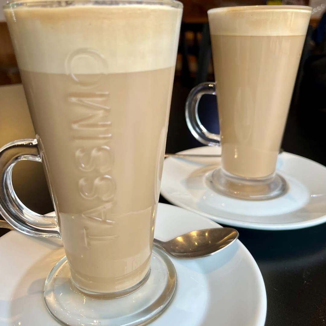 Two lattes served in tall glass mugs at Lento Cafe and Bar Leeds