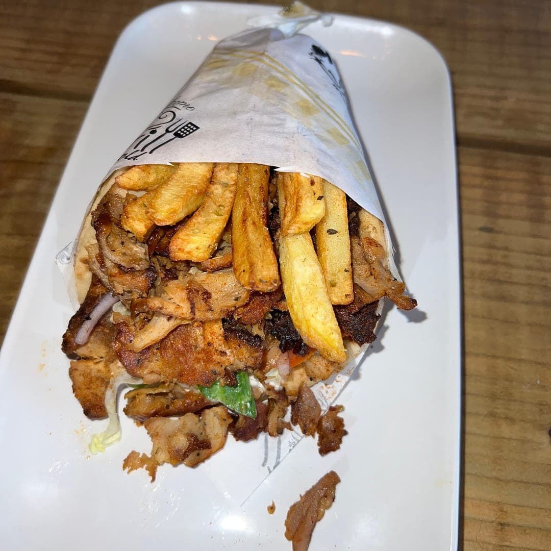 Loaded chicken gyros wrap with fries at Mistreci Greek cafe Leeds