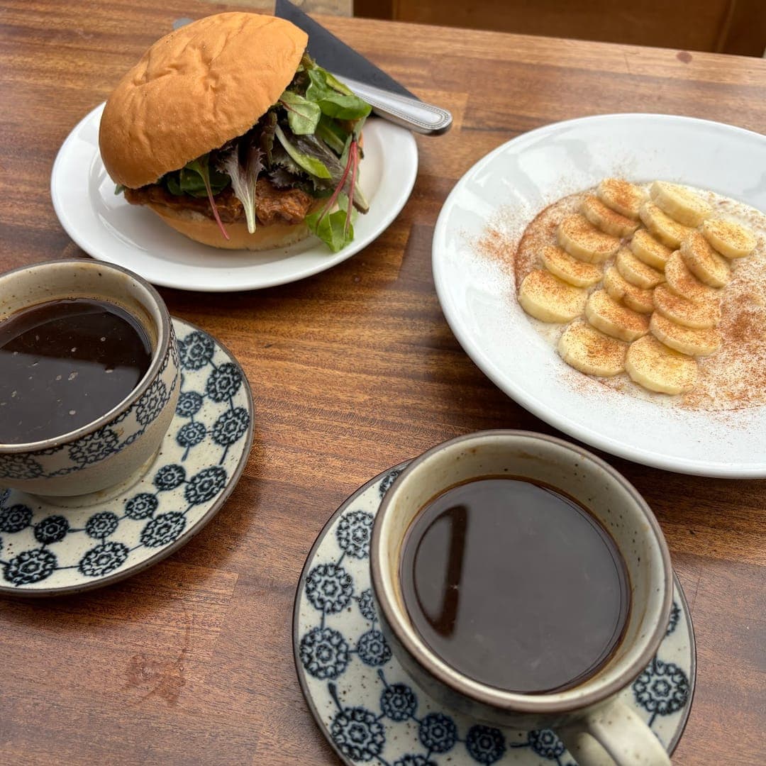 Burger, banana pancakes with cinnamon, and coffees at The Barn Coffee Shop