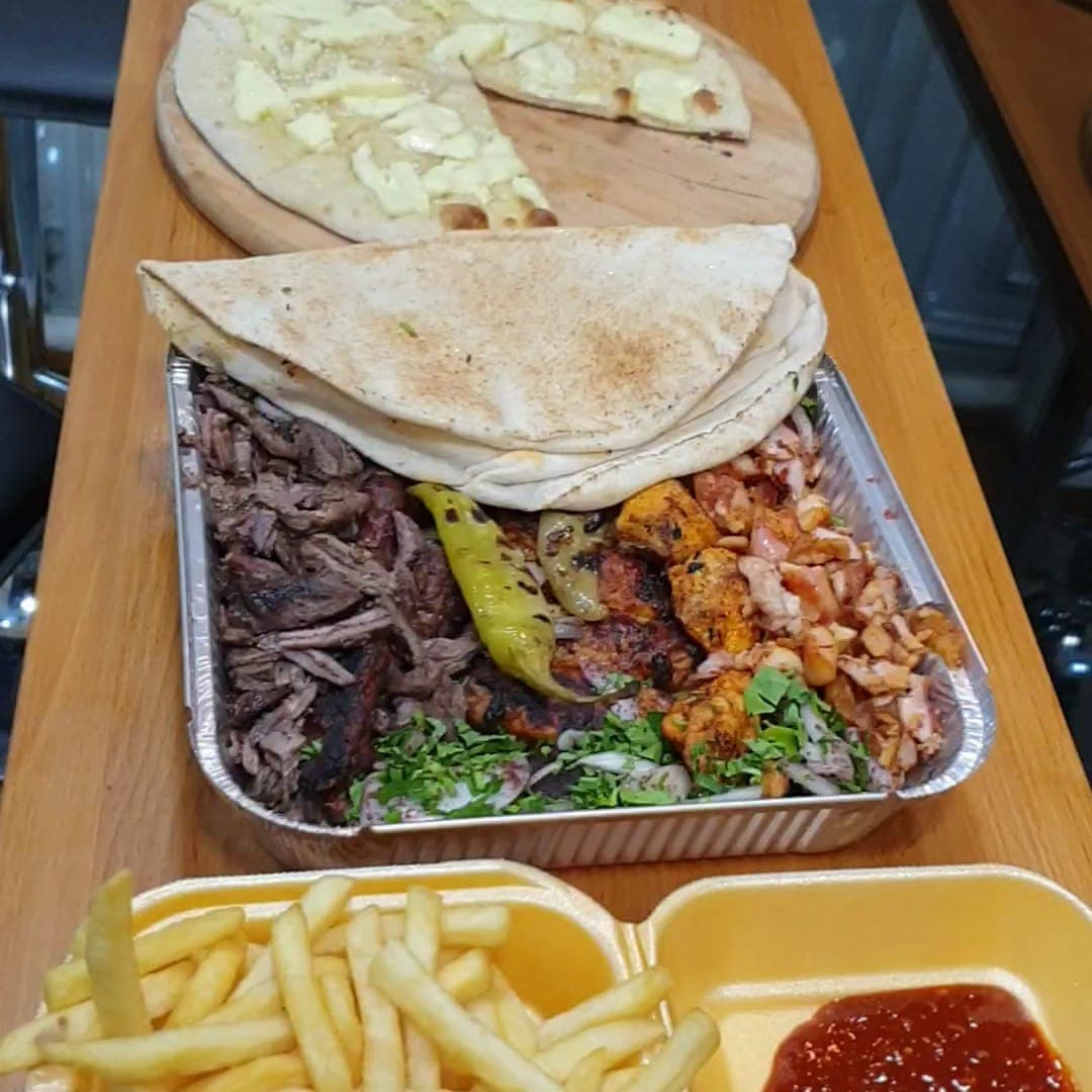Lebanese Bites — spread of dishes including manakish, wraps and fries