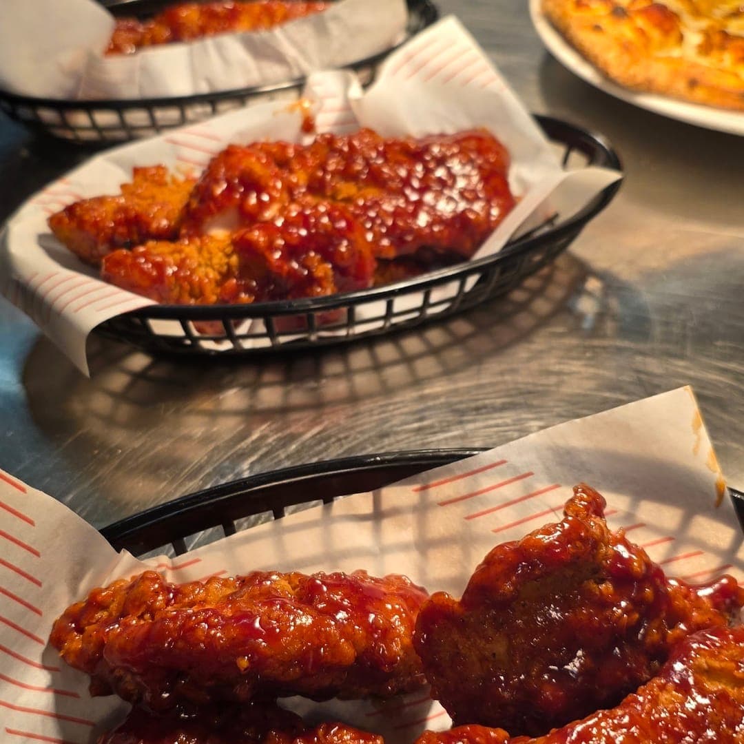 Panorama Garden — saucy chicken wings and loaded fries in serving baskets