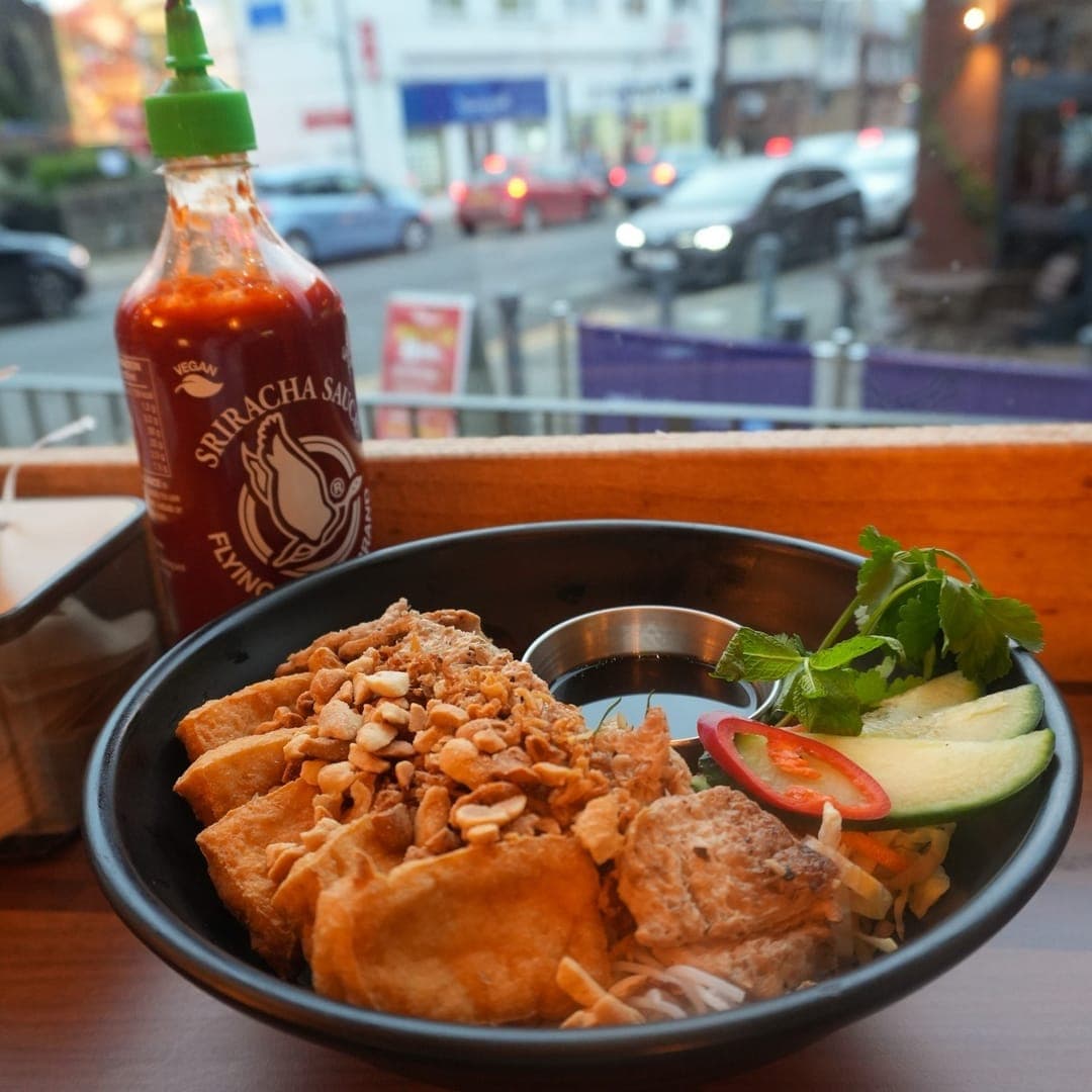 Pho 37 (Merrion Centre) — Vegan Chicken Bun Cha with peanuts and fresh herbs in a black bowl