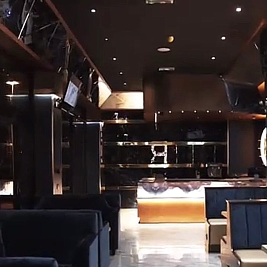 Riviera lounge — lounge interior with velvet seating and illuminated bar