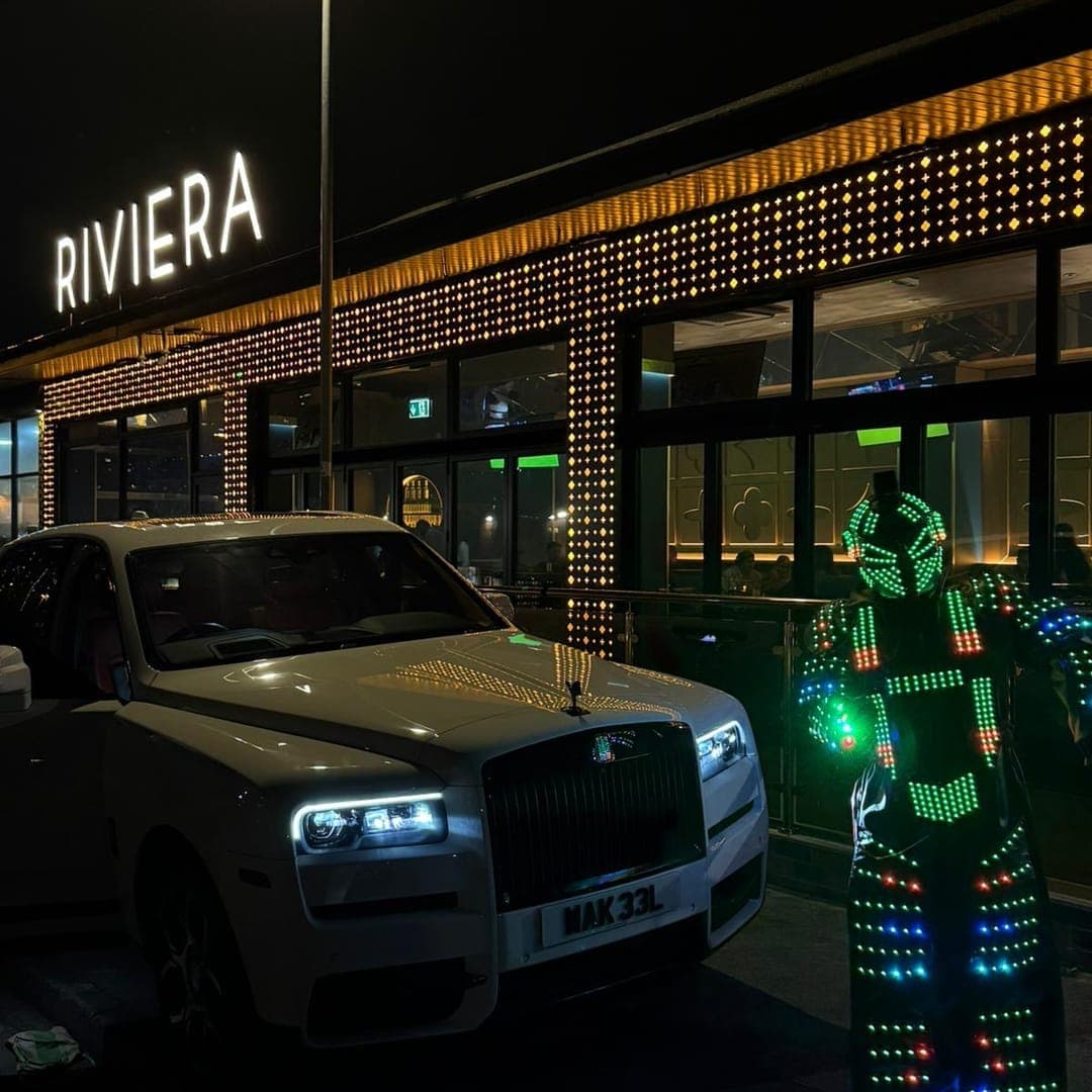 Riviera lounge — exterior night view with illuminated Riviera sign