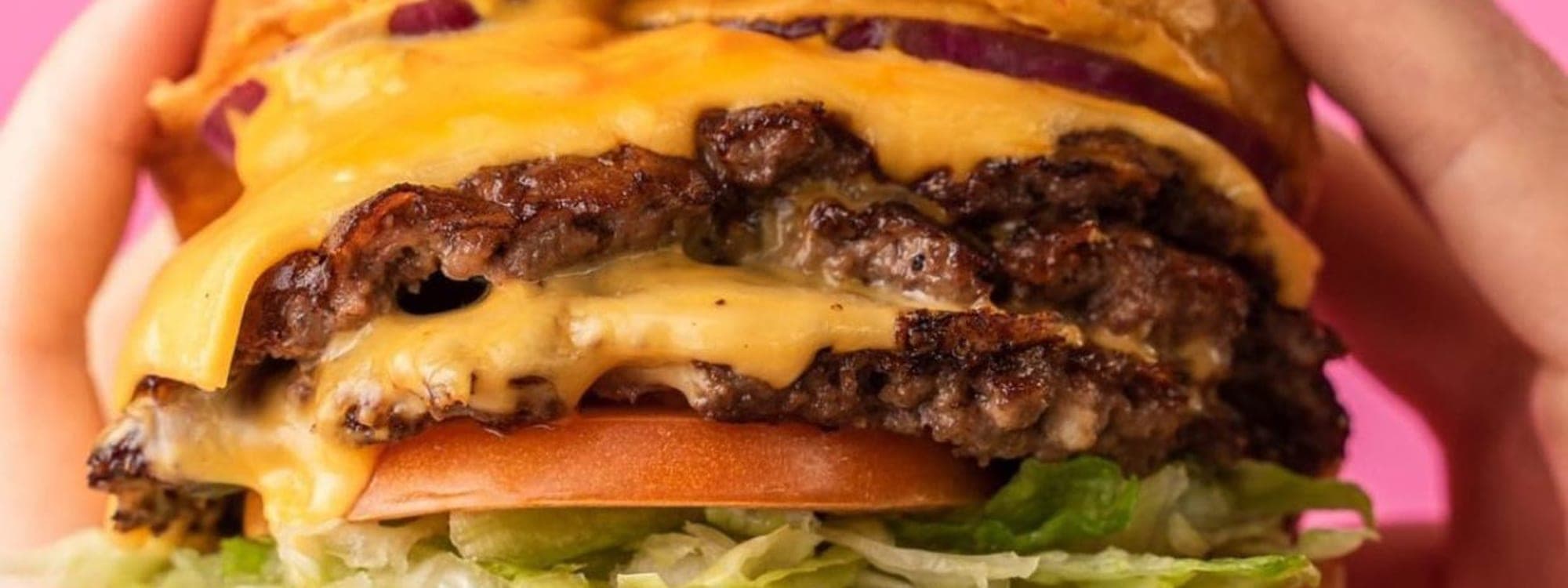 Route 66 — a towering double cheeseburger with melted cheddar, lettuce and tomato