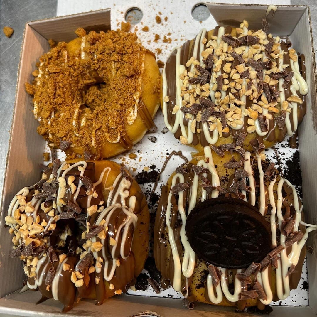 Route 66 — selection of loaded dessert donuts in a takeaway box