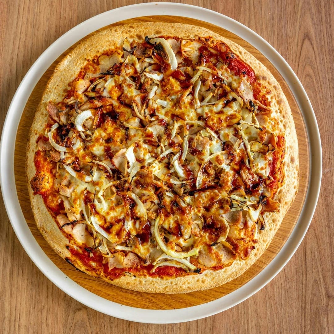 Secret Sky — chicken and mushroom pizza on a white plate