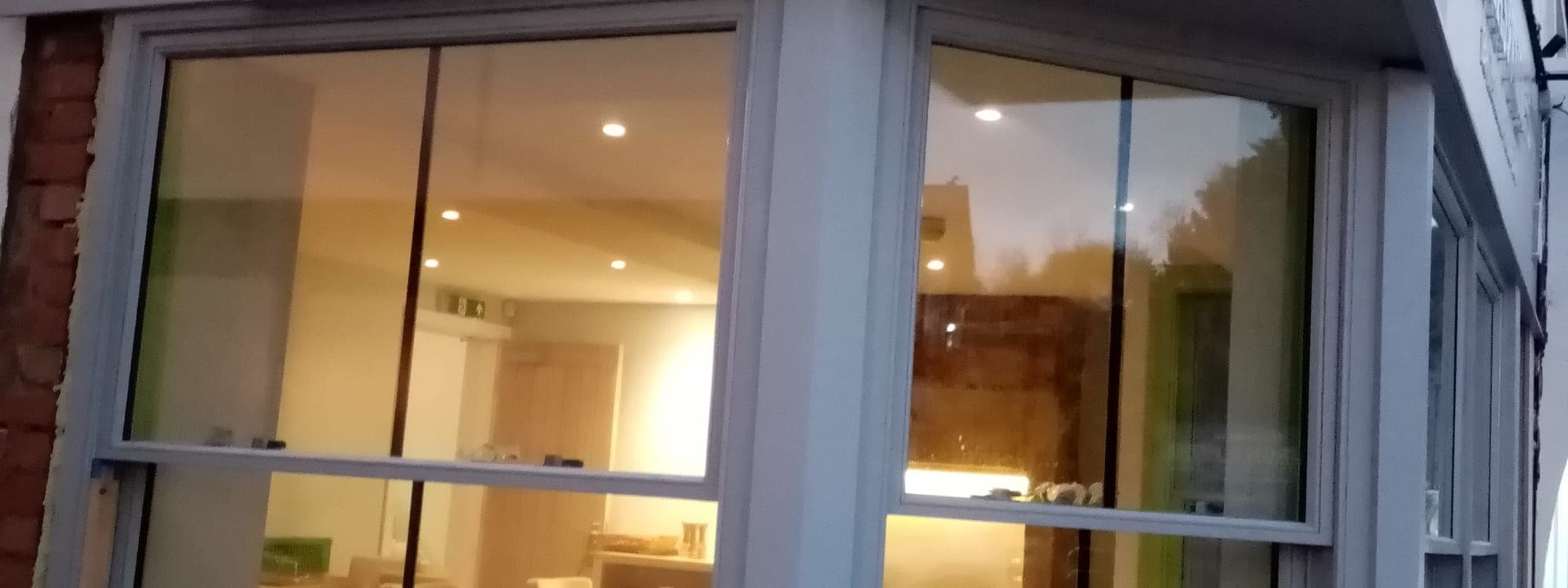 Tapas & Tunes — illuminated shopfront with signage at dusk, Otley