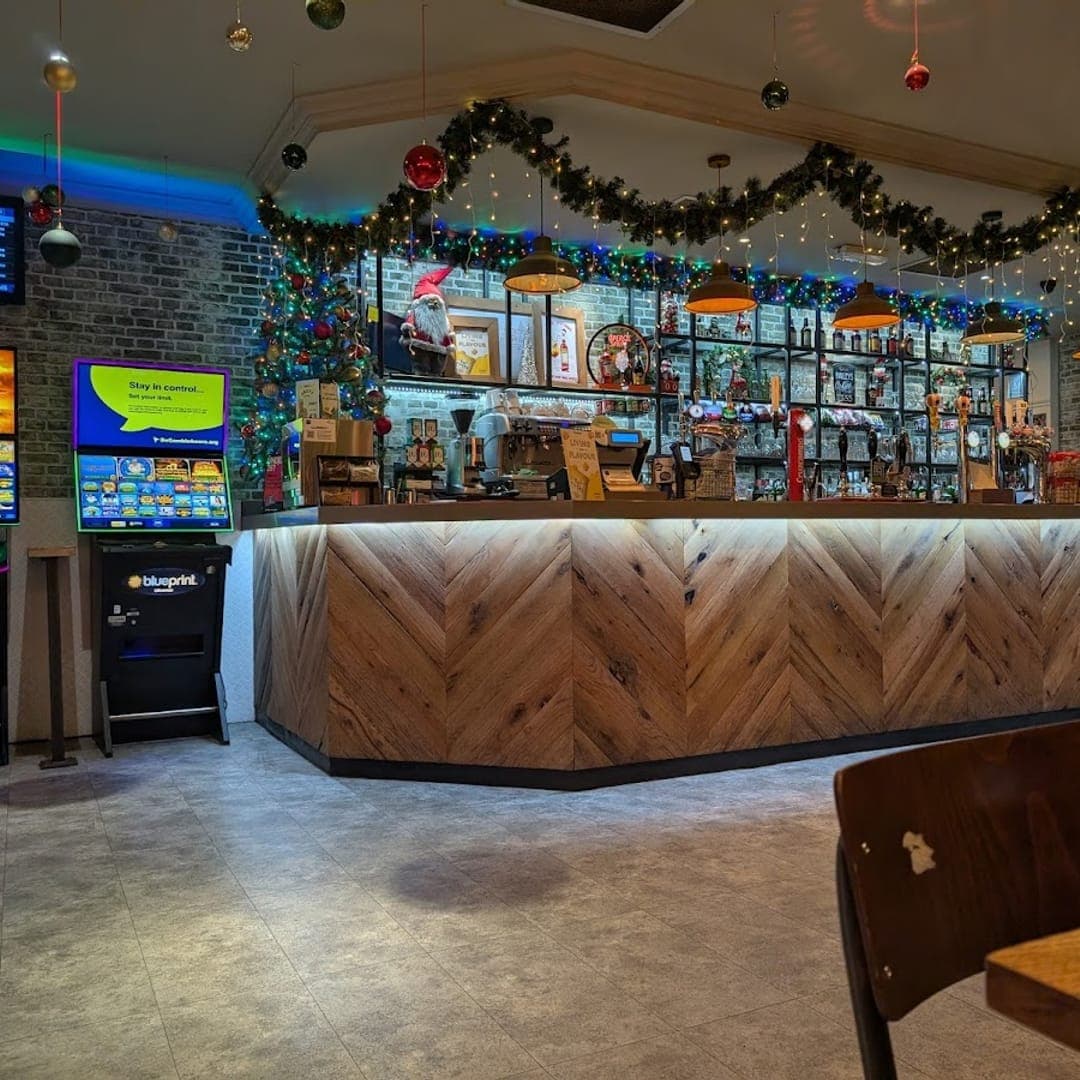 The Beer House Leeds interior bar area with herringbone bar front and pendant lights