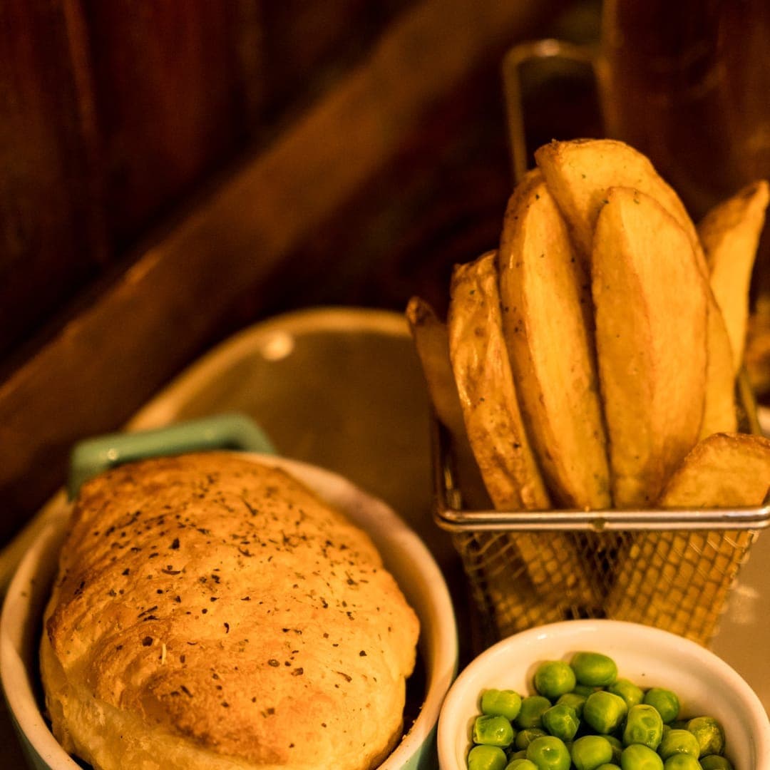 Pub pie with peas and bread at The Ship Inn, Leeds